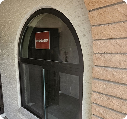Arched Milgard window installed on home exterior